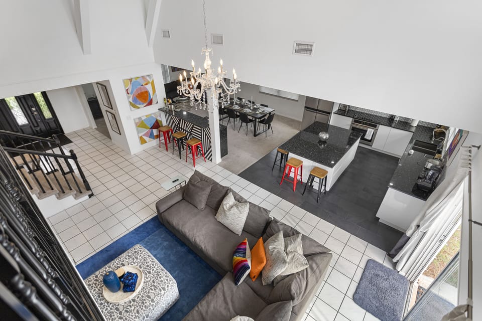 aerial view of living room, kitchen and dining room