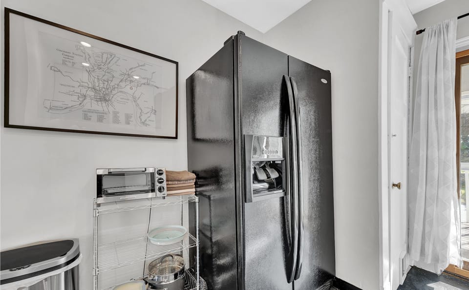 Full-size fridge with ice-maker, toaster oven, and touchless trash can