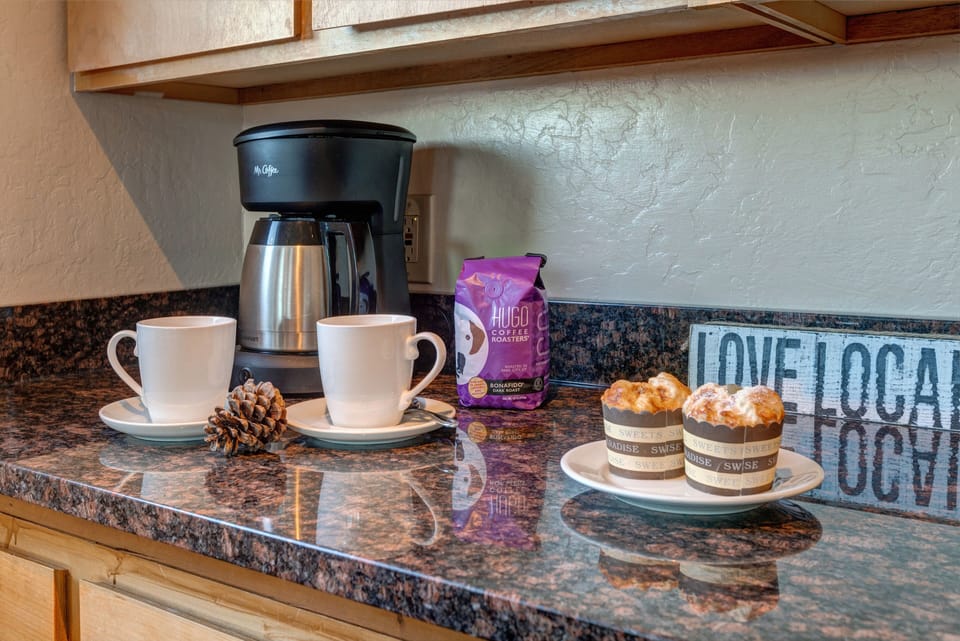 Fully Equipped Kitchen with beautiful stone countertops, GE Appliances, ample space, and bar seating for 6