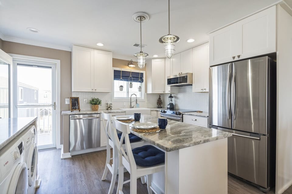 Fully equipped kitchen - all appliances are new.  Door goes to deck & ocean view