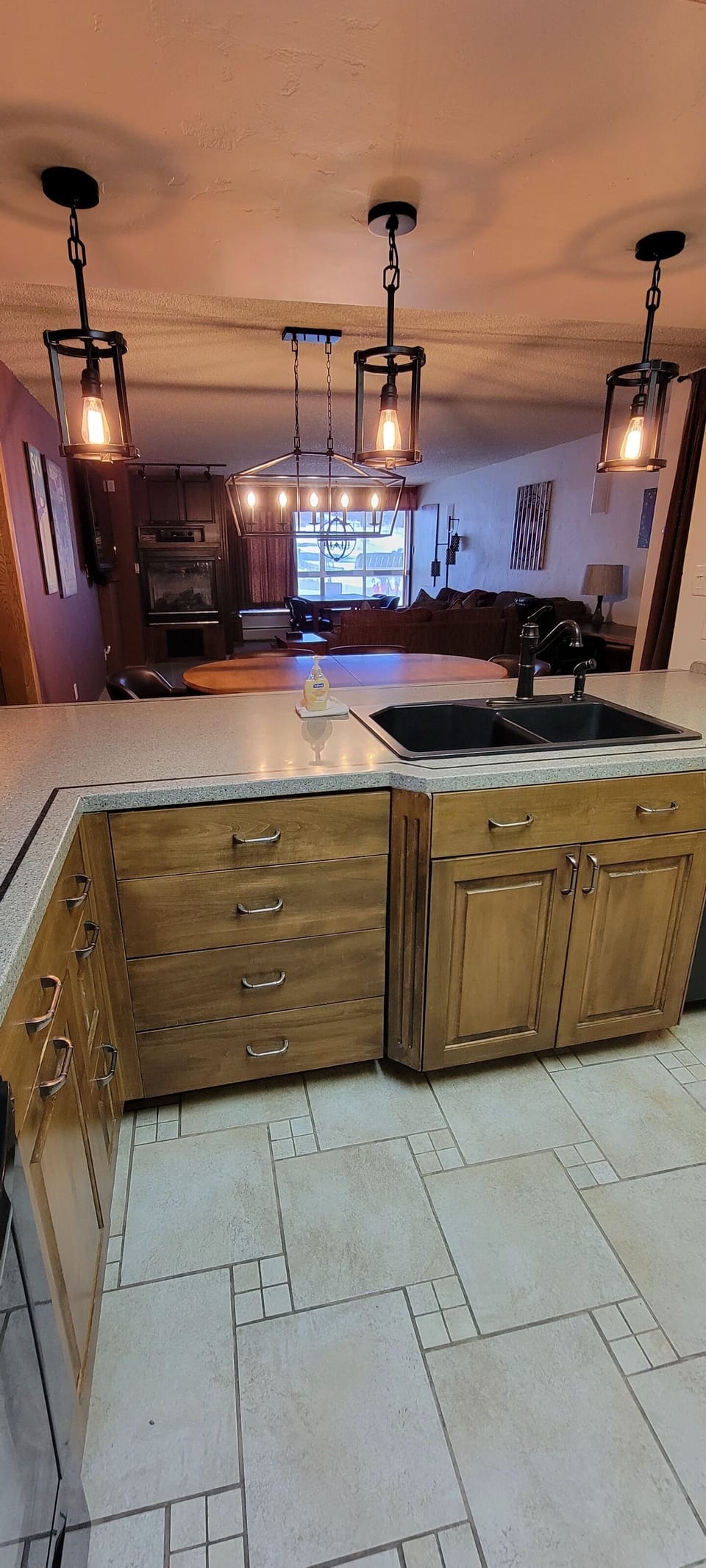 Full kitchen with open views of living room and dining area.