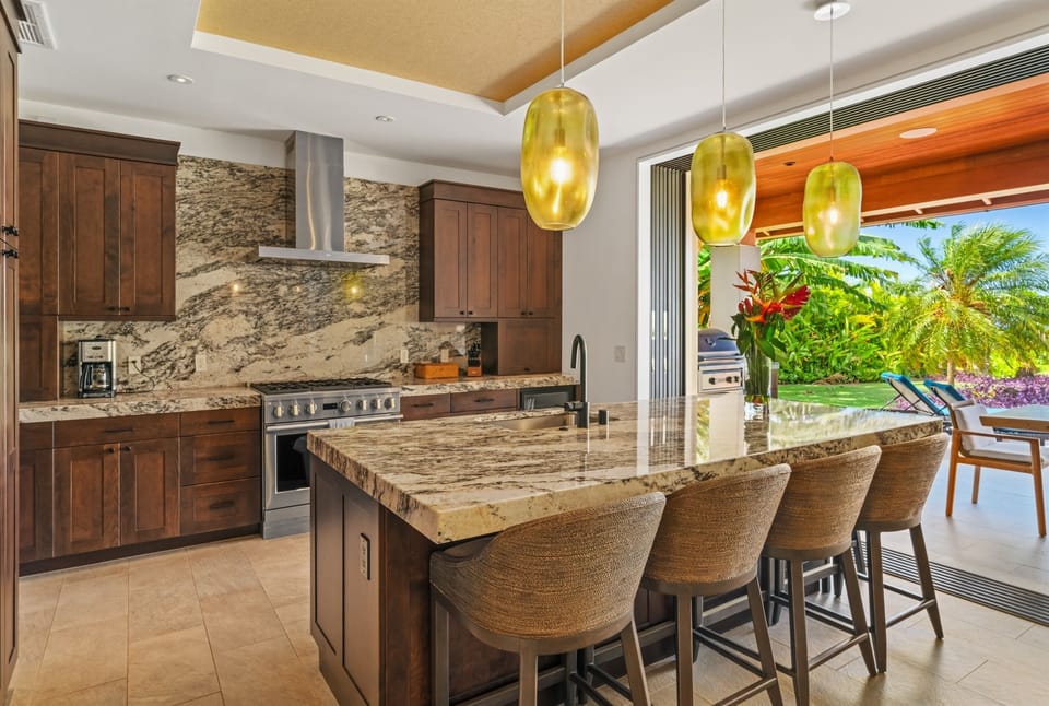 Maluhia Makai - Fully equipped kitchen with island bar (seats 6), modern amenities, including a beverage fridge. Gas BBQ completes a chef's dream. - Legacy Vacations Hawaii