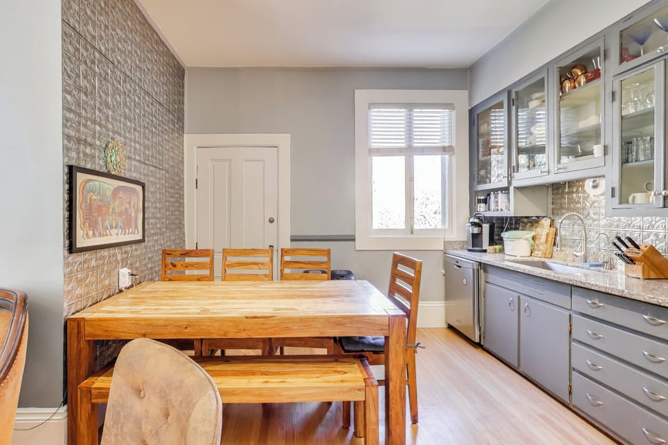 Dining table in the kitchen area (the laundry room is behind that door)