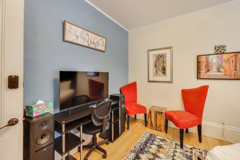 The other front bedroom is the blue room.  It also has a nice view on Noe street, a desk and a wardrome/bureau.