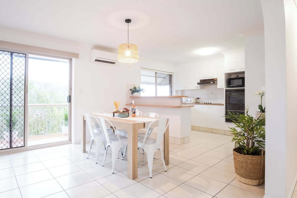 Open plan kitchen, dining, and living area.
