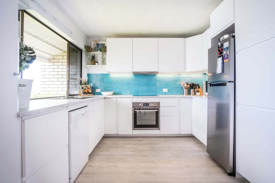 Fully equipped kitchen with views towards the river.