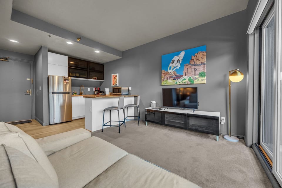 Living area: Smart TV with cable (40"), Building-controlled central heat and A/C (air speed can be adjusted by guests)