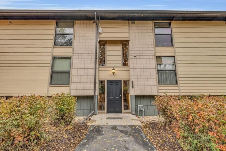 An exterior view of the building the condo is located in front of the building entrance.