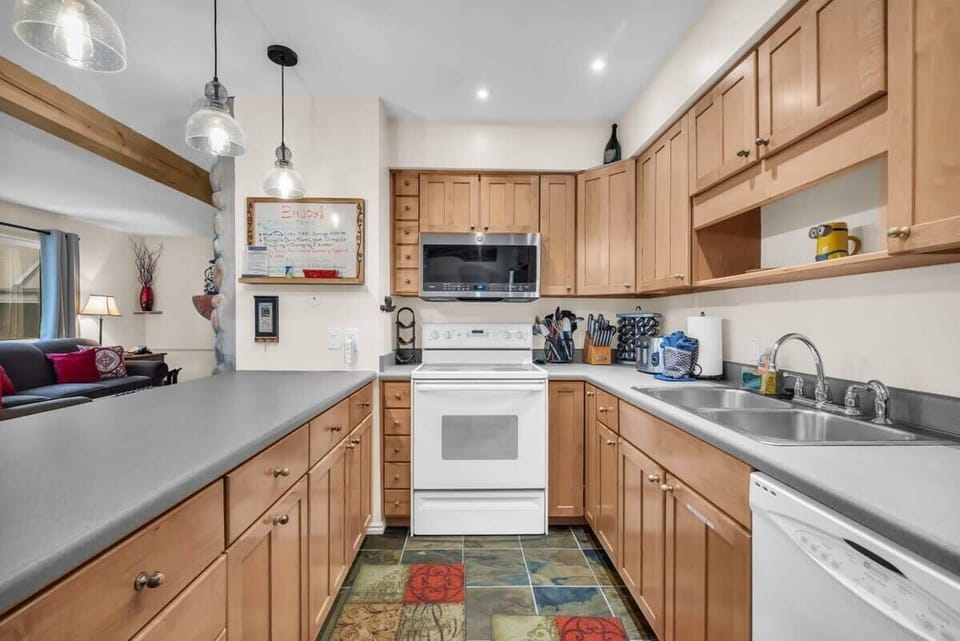 The fully-equipped kitchen has everything you need to prepare delicious meals at home and includes a breakfast bar seating for up to 3.