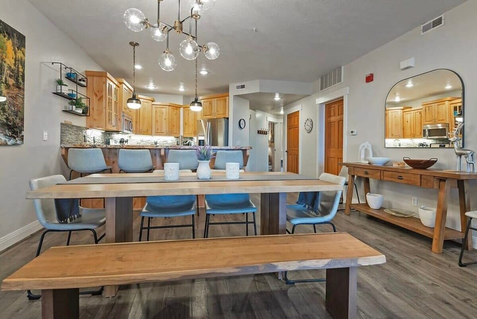 The stylish dining room features a table with seating for six conveniently located next to the kitchen where you will find a kitchen bar with additional seating for four.