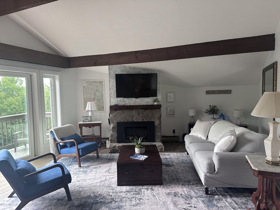 Brand new! Living room with new floors, walls, fireplace and equipment