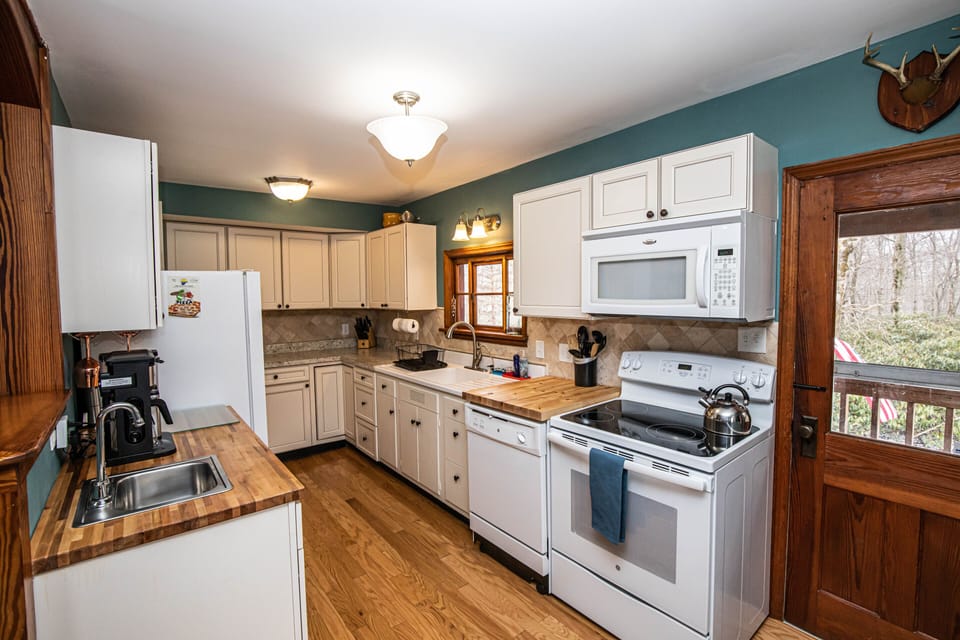 Large Kitchen w everything required to make a great meal! Including wine fridge!