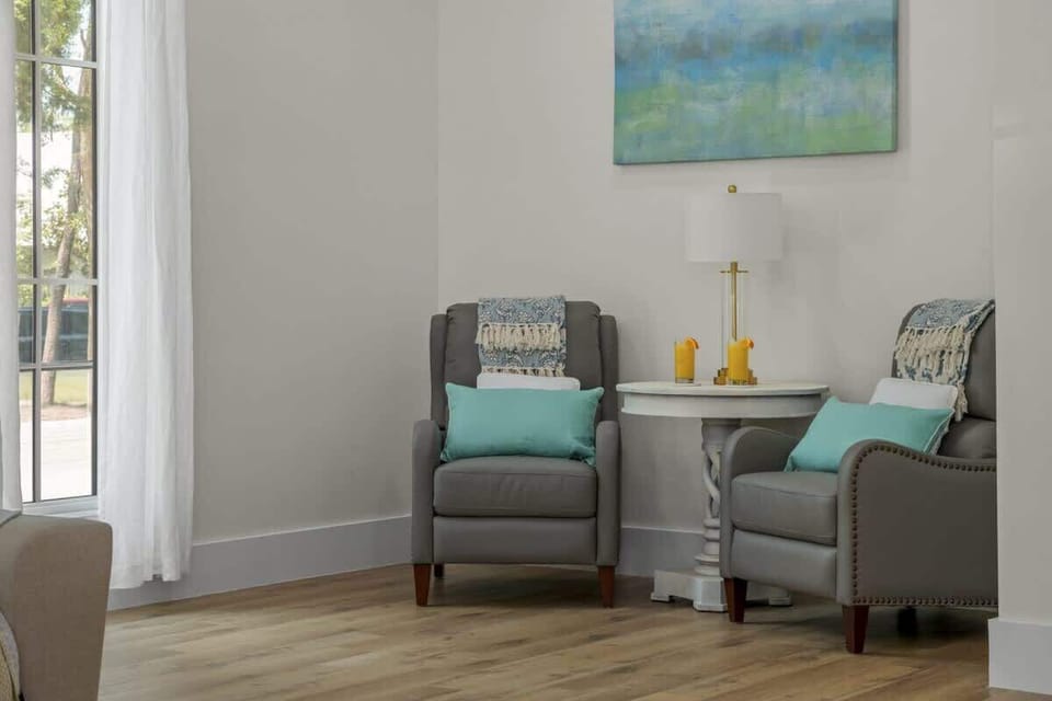 New large Living Area space with 14' ceilings and 75" Smart TV. The sectional sofa has a queen memory foam sleeper mattress.