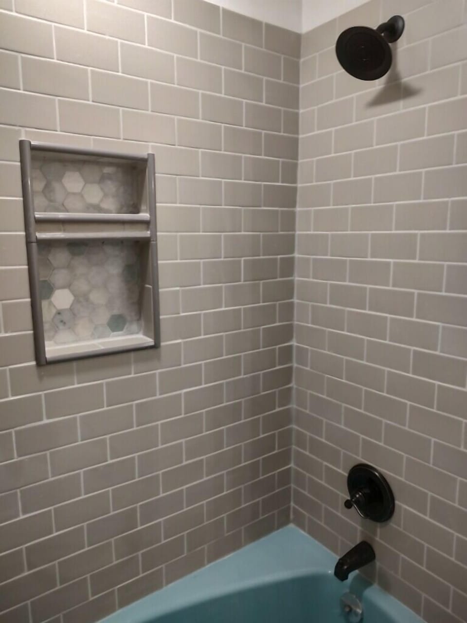 Main floor shower/tub with original vintage cast iron tub