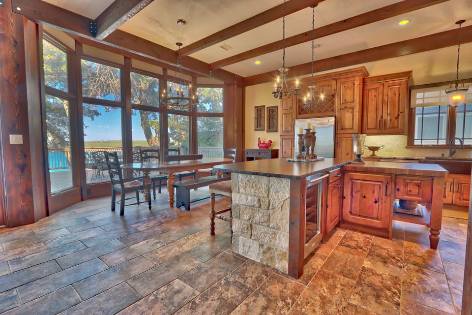 As you enter and walk down the hall, the kitchen will be on your right.
