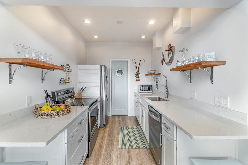 Galley kitchen open to family room