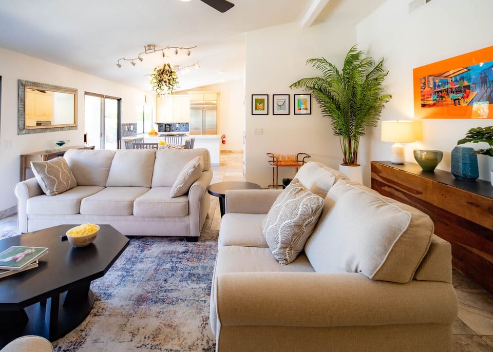Open concept living room with pool views
