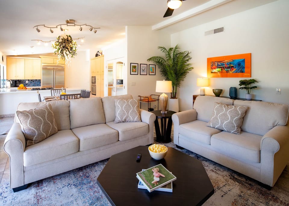 Open concept living room with pool views