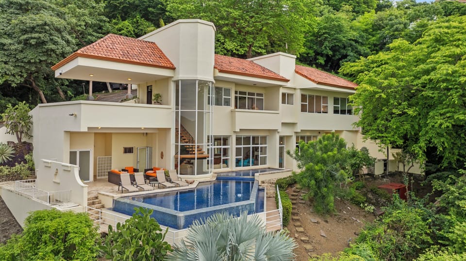 This stunning two-level home has a huge pool, loads of outdoor space and 4 bedrooms, each with an ensuite bathroom.