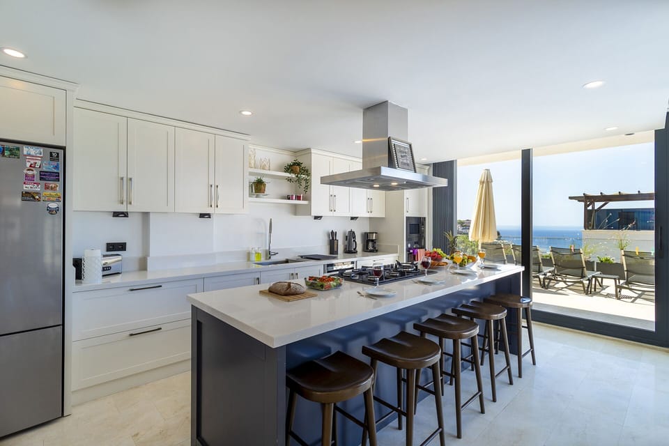 Open plan fully fitted kitchen with an island unit