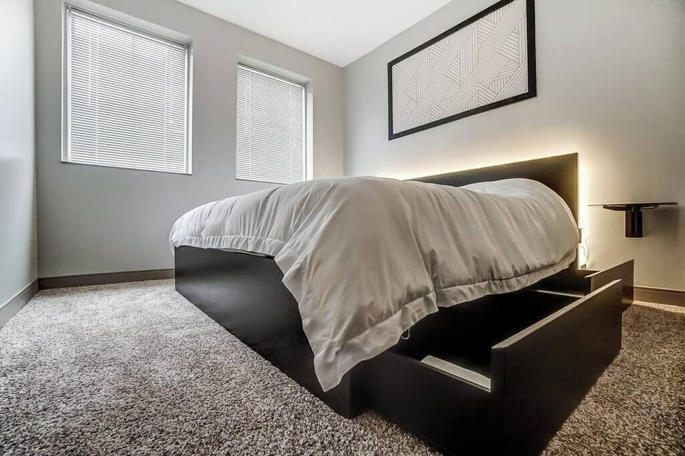 Bedroom Features:
 - 12 Inch King sized Latex & Memory foam 
    Hybrid Mattress
 - Adjustable ambient lighting behind the 
    headboard of the bed.
 - Floating night stands
 - Pull out storage containers beneath the bed.
 - Blackout curtains (new)