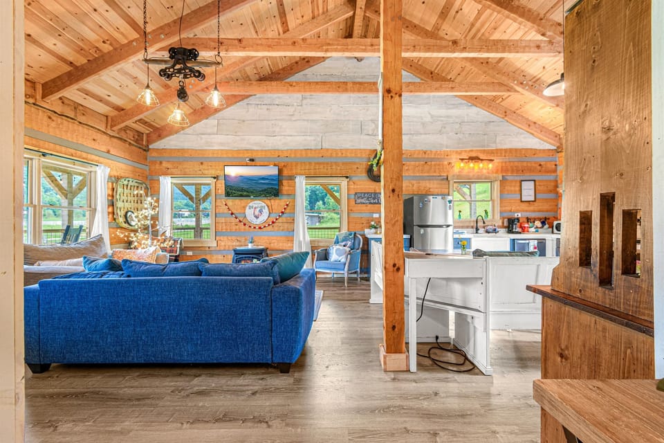 Hand hewn log beams and an open concept in the living area