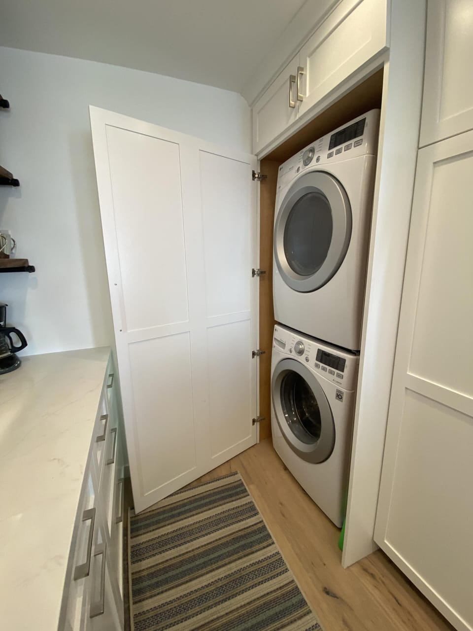 Washer and dryer are located in the kitchen and come with detergent to start you off.