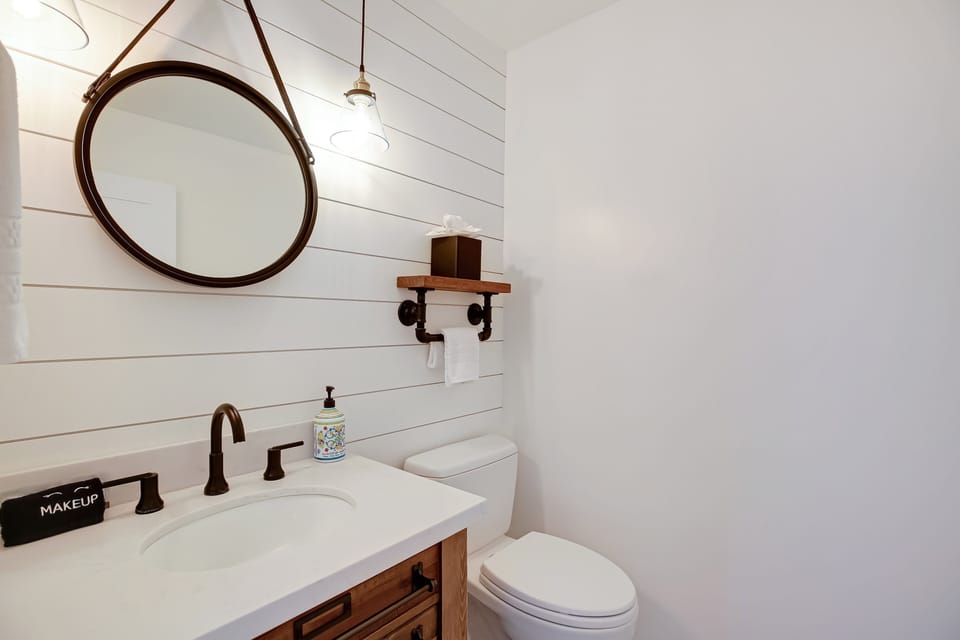 Guest half bathroom located downstairs.