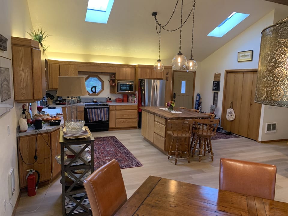 Kitchen island with front door of view.