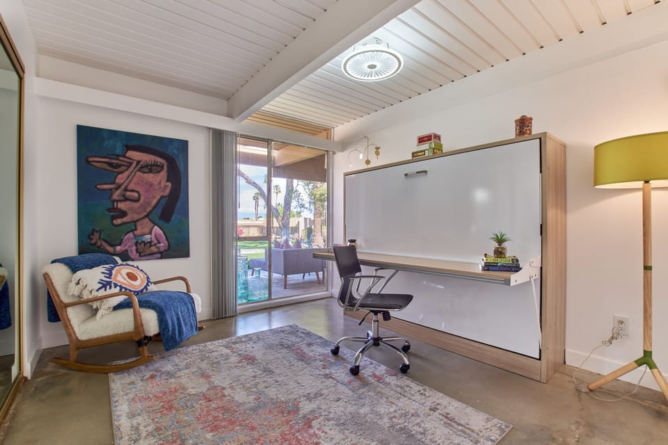 Office set-up with easy to convert murphy bed (full size).