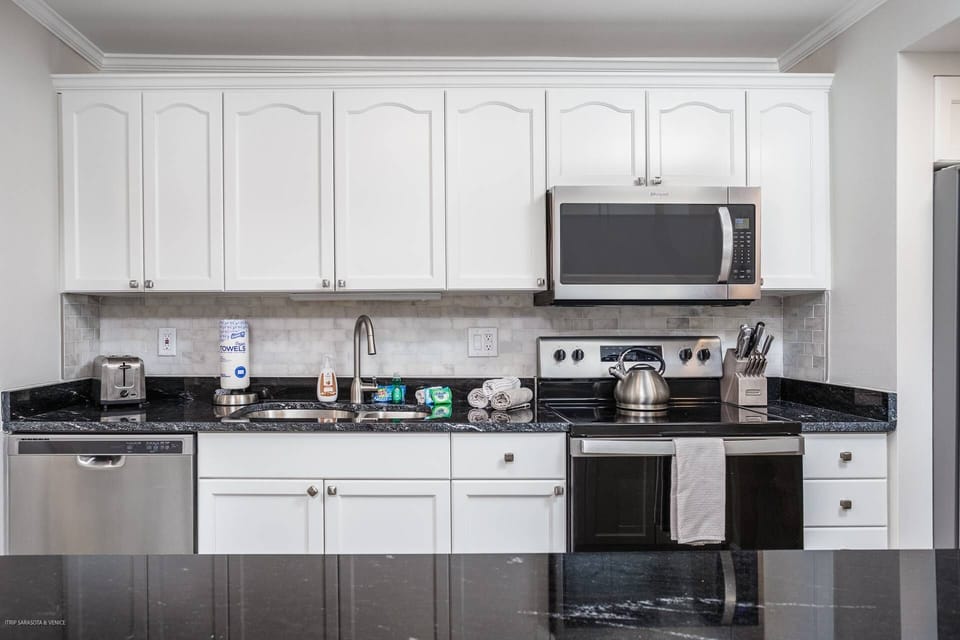 The kitchen is now fully open to the dining and living room