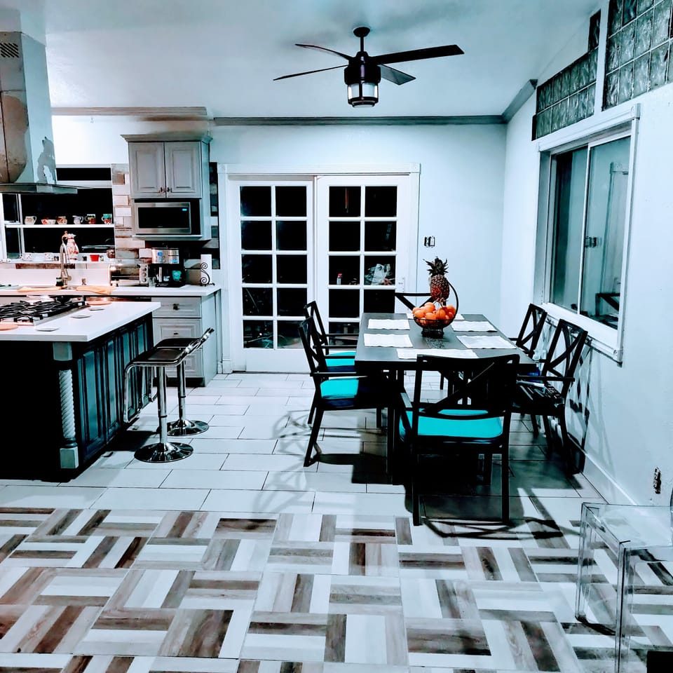 Table for six and two stools, also extra clear chairs.