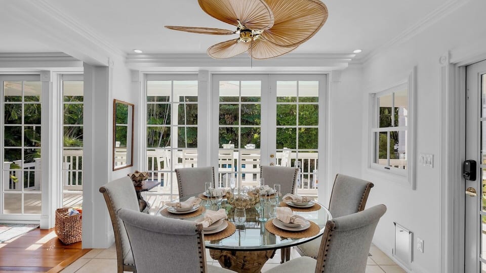 The dining area with additional seating at the kitchen table...