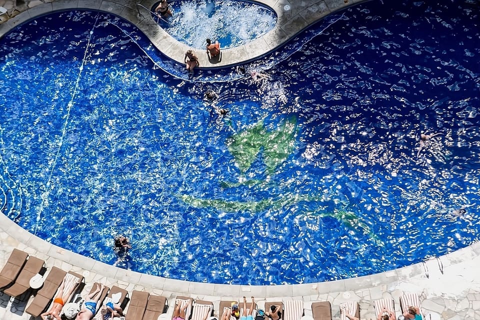 Sip tropical drinks and linger beside the sparkling pool.