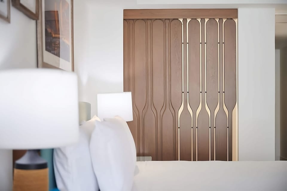Enjoy added privacy with a stylish divider and warm lighting.