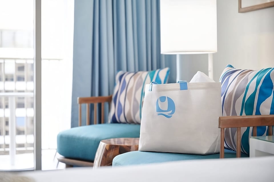 Enjoy soft textures and sunny seating steps from the balcony.