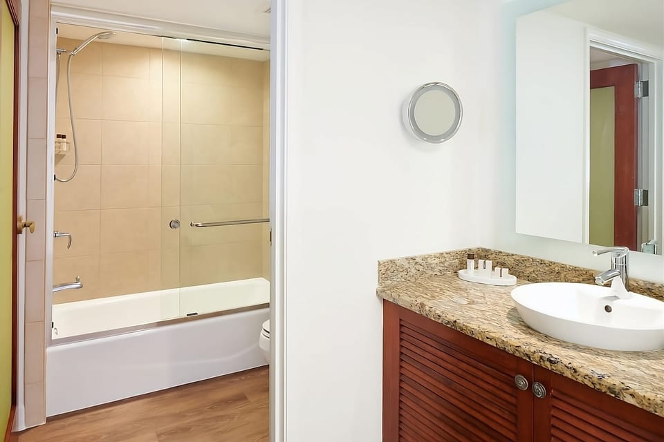 Refresh easily with bright vanity space and deep soaking tub.