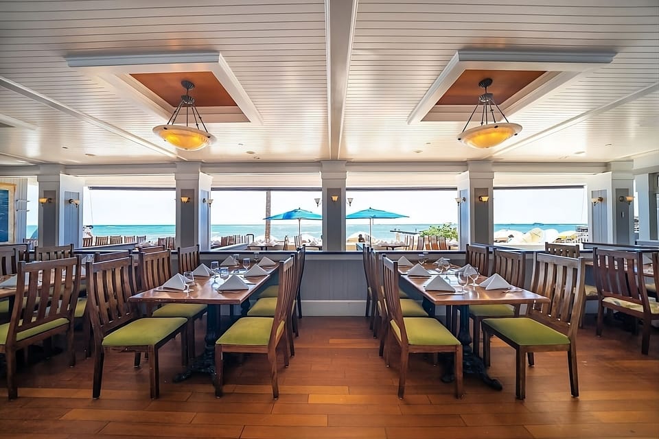 Savor ocean breezes over a relaxed, polished dining room.