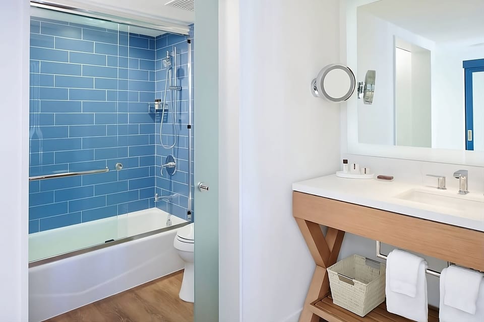 Rinse off in a sleek shower-tub with fresh towels ready.