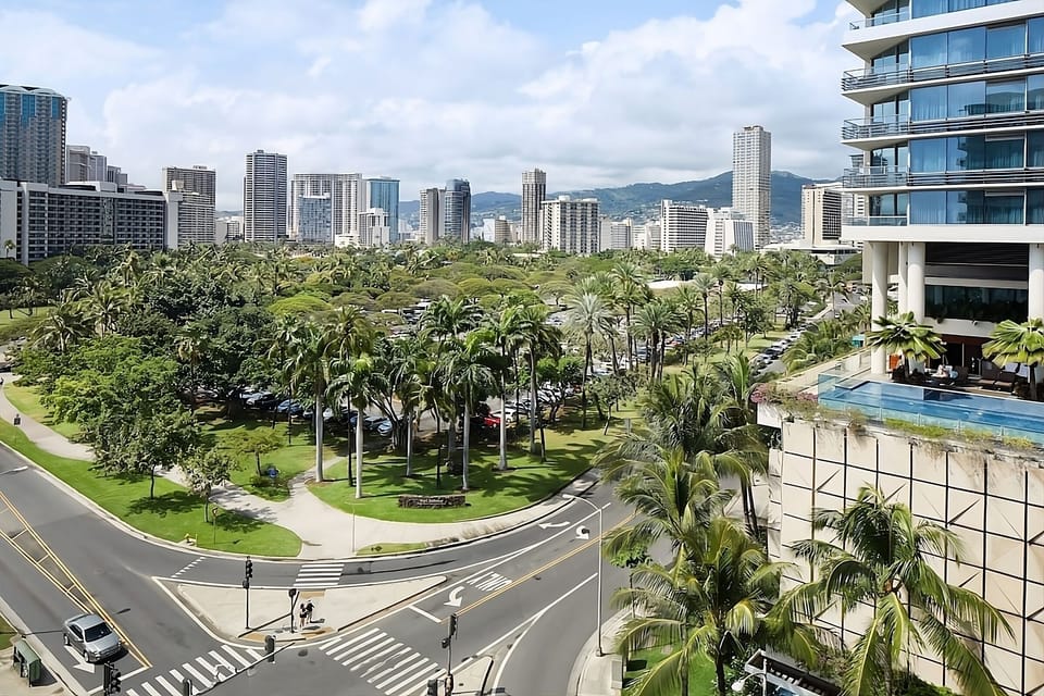 Breathe in city-meets-tropical views beside the sparkling pool.