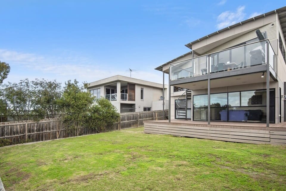 Both living areas flow onto decks. Big secure backyard for children and pets to play