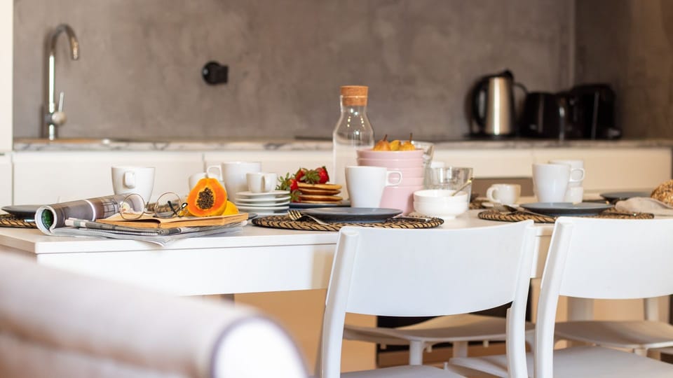Prepare delightful meals in the well-equipped kitchen with modern appliances, then transition seamlessly to the spacious dining table where you can savor your creations. This open-concept area makes entertaining and family meals effortlessly enjoyable.