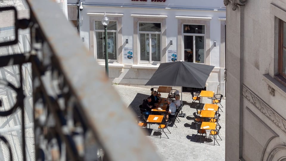 Sip your morning coffee or enjoy an evening aperitif from your private balcony, offering a charming view of the bustling street below and a vibrant outdoor cafe scene. Immerse yourself in the lively city atmosphere right from your accommodation.