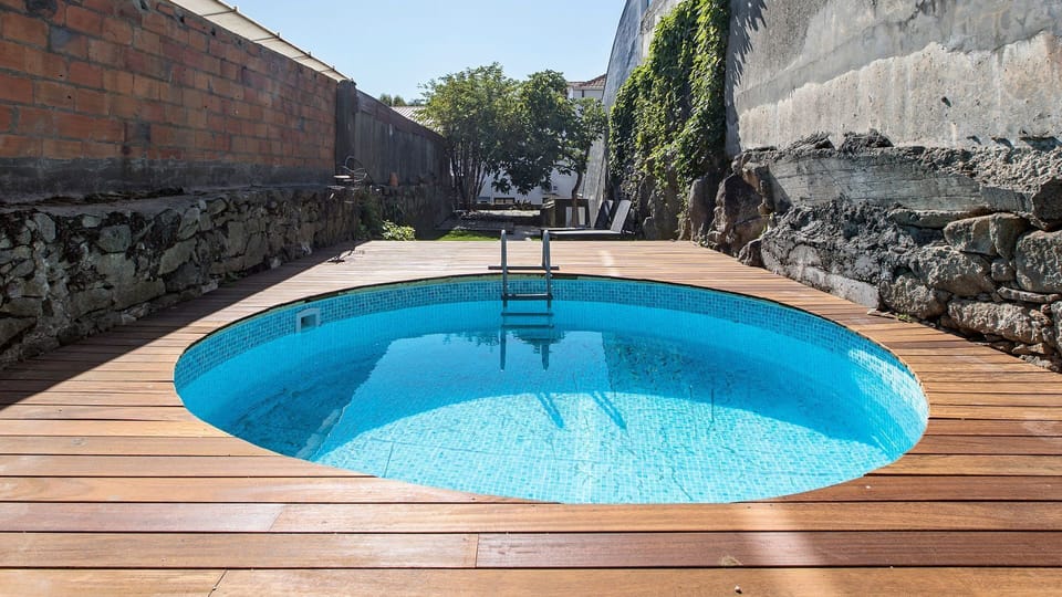 Pool with beautiful wooden deck #airbnb #porto #downtown