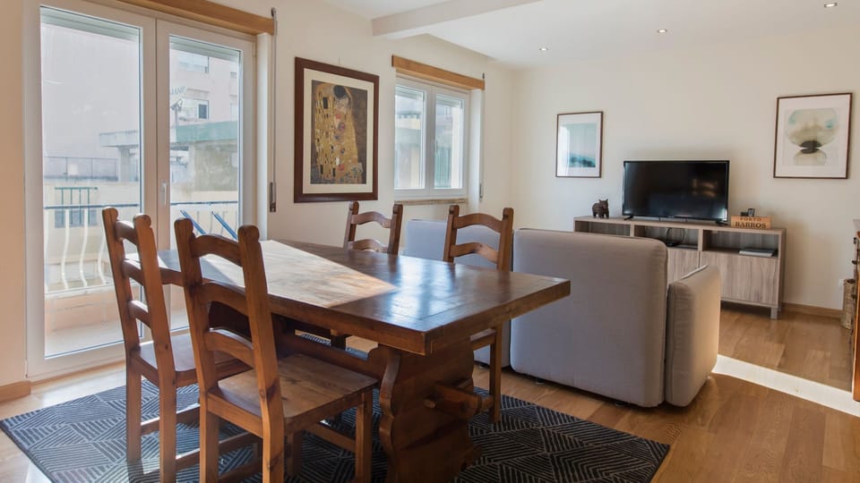 A lovely living space and dining area with access to the balcony