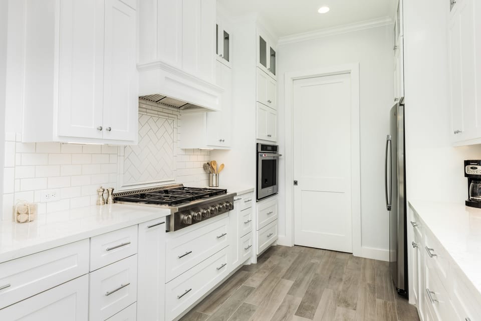 Fully equipped kitchen with stainless steel appliances and gas range