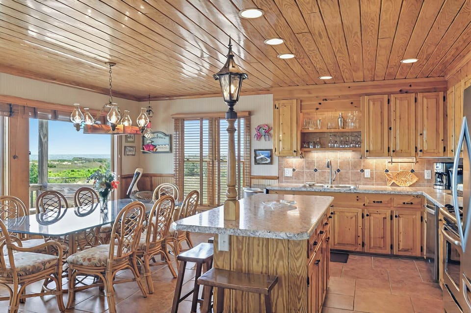 Dining Room & Kitchen Area with view of pool, dunes and ocean