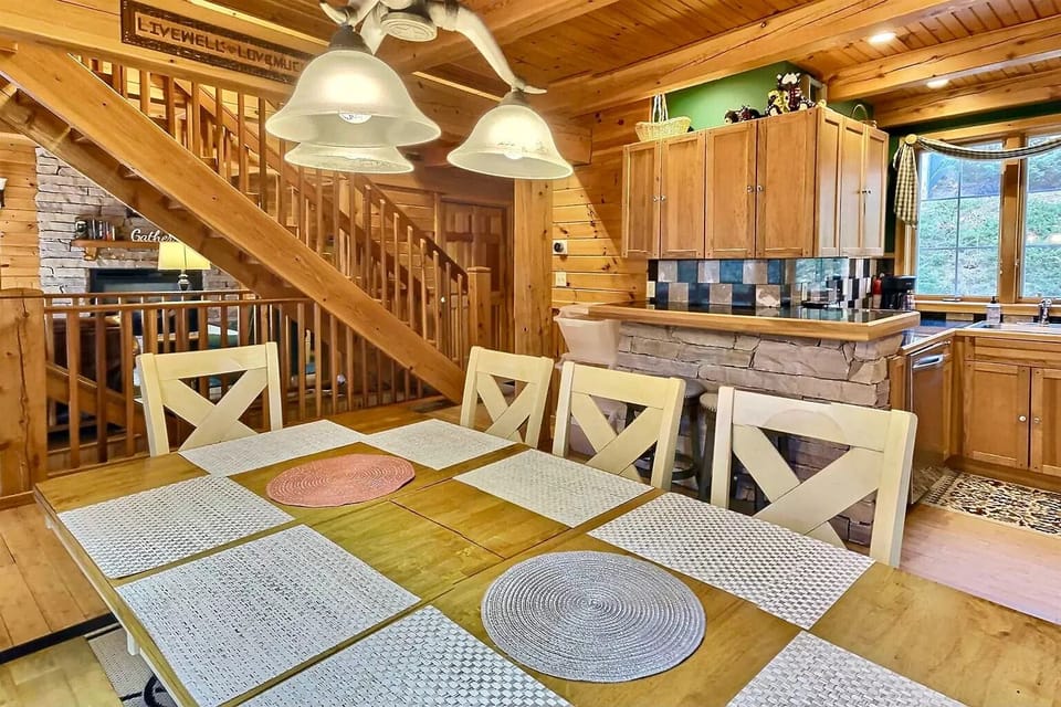 Dining room view facing counter area, stairs, and living room.