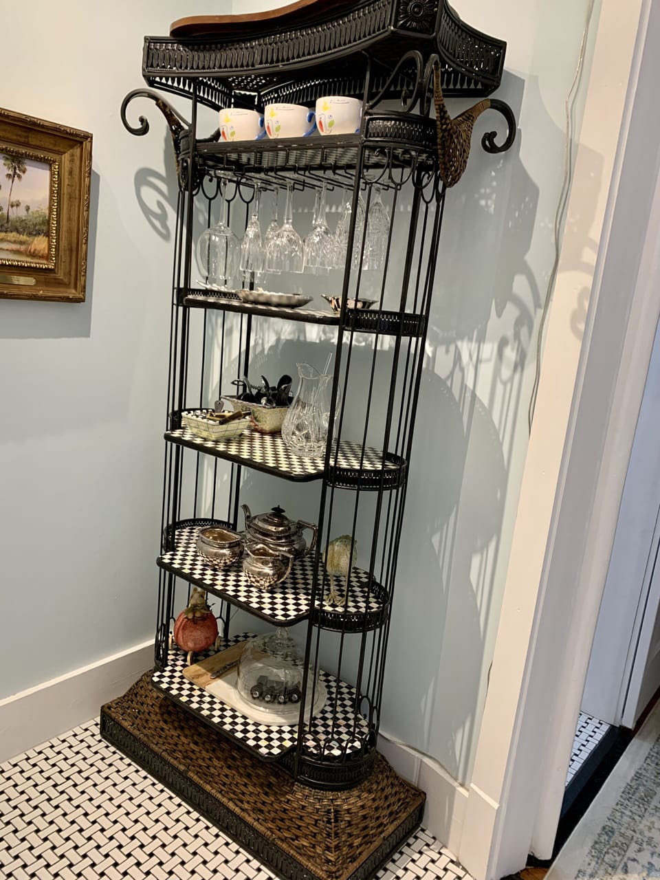 Etagere with bar glasses and barware