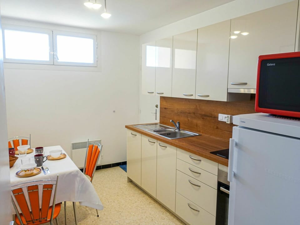 Cabinetry, Furniture, Property, Window, Building, Countertop, Table, Drawer, Sink, Chair